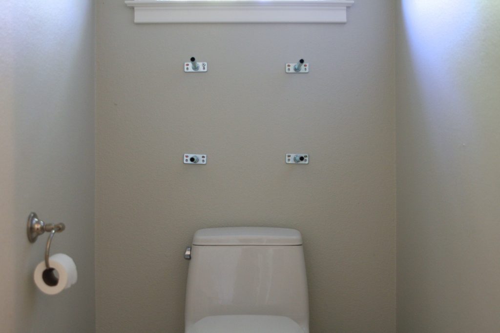 Simply Organized Floating Shelves in the Powder Room
